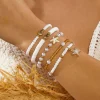 Coastal Boho Stacked Bracelets – Shell, Starfish & Pearl Layers for Summer Escapes